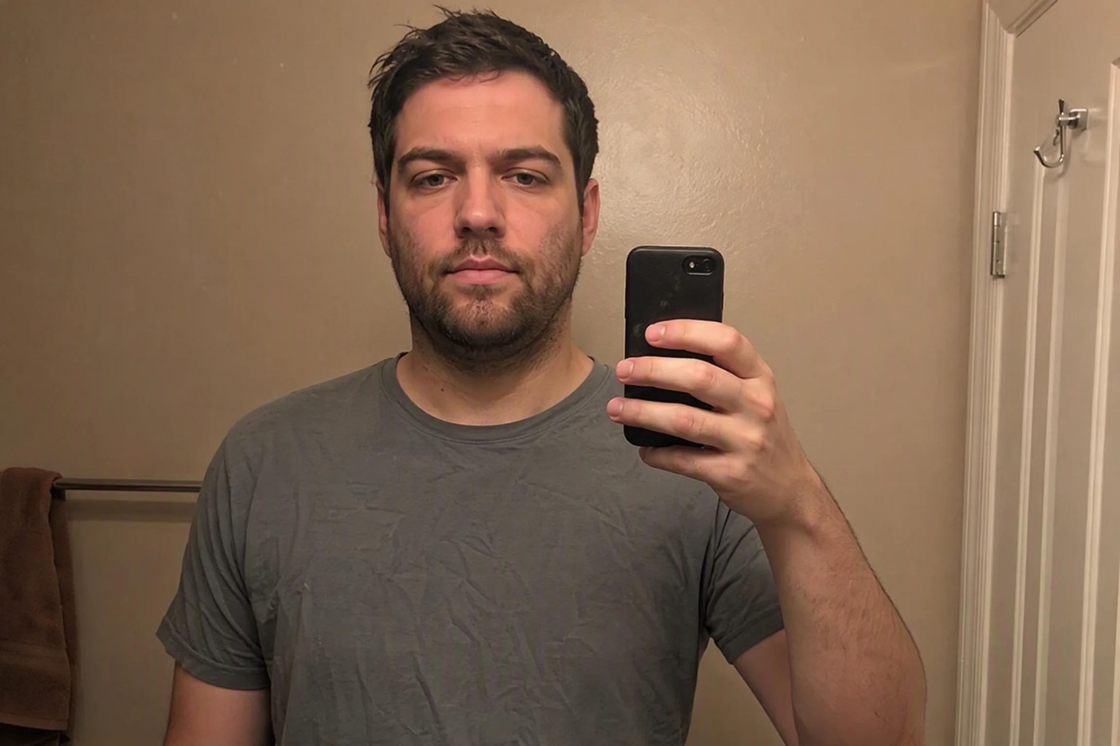 Before and after comparison of professional corporate headshot transformation from bathroom selfie - before