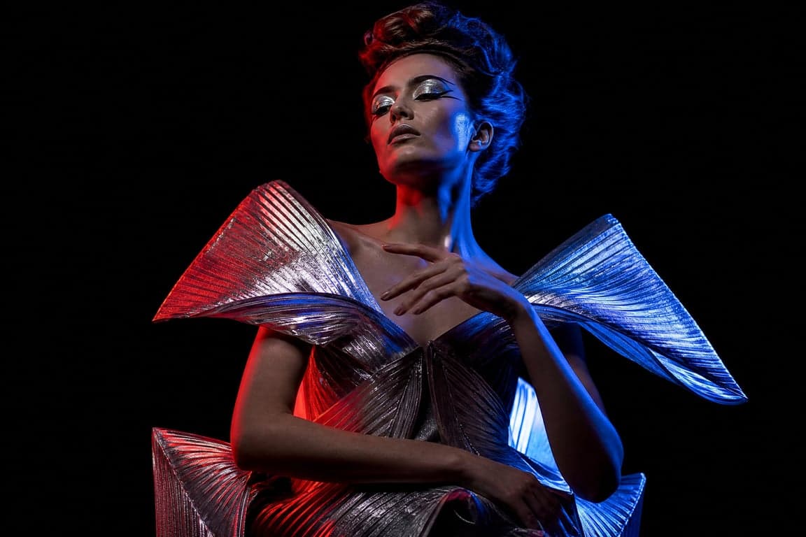 Before and after comparison of avant-garde fashion editorial portrait with dramatic split lighting