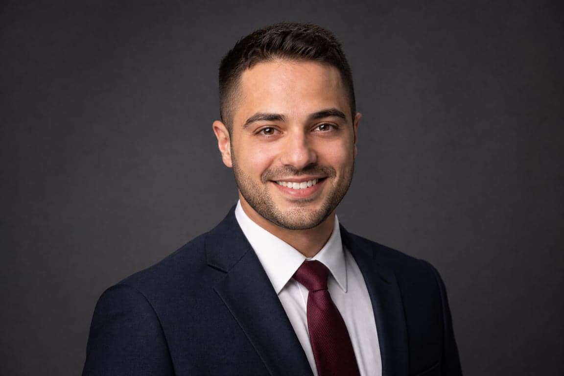 Before and after comparison of professional corporate headshot transformation from bathroom selfie